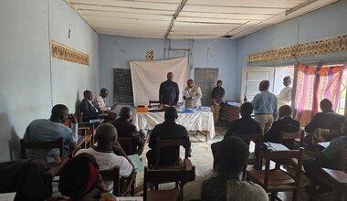 A group sits for a presentation.
